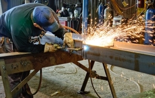 RCI worker welding at our in-house fabrication shop