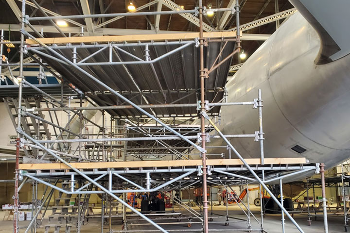 Aircraft on Ground project site with scaffolding next to the plane