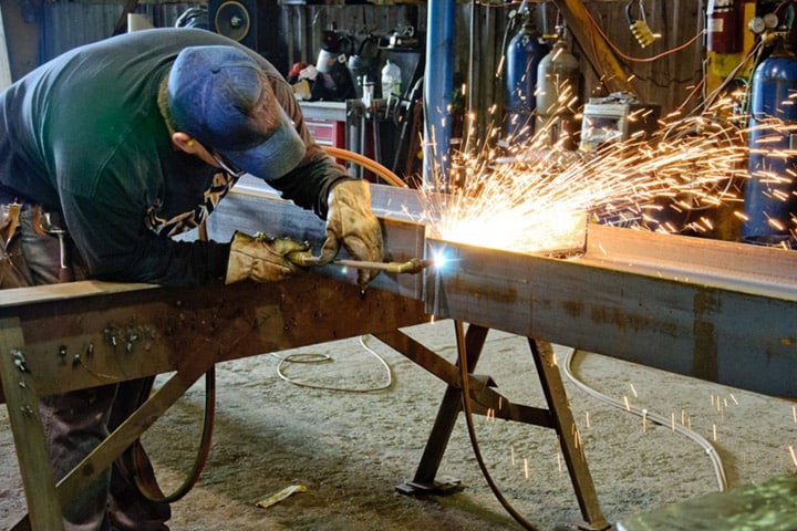 RCI worker welding at our in-house fabrication shop